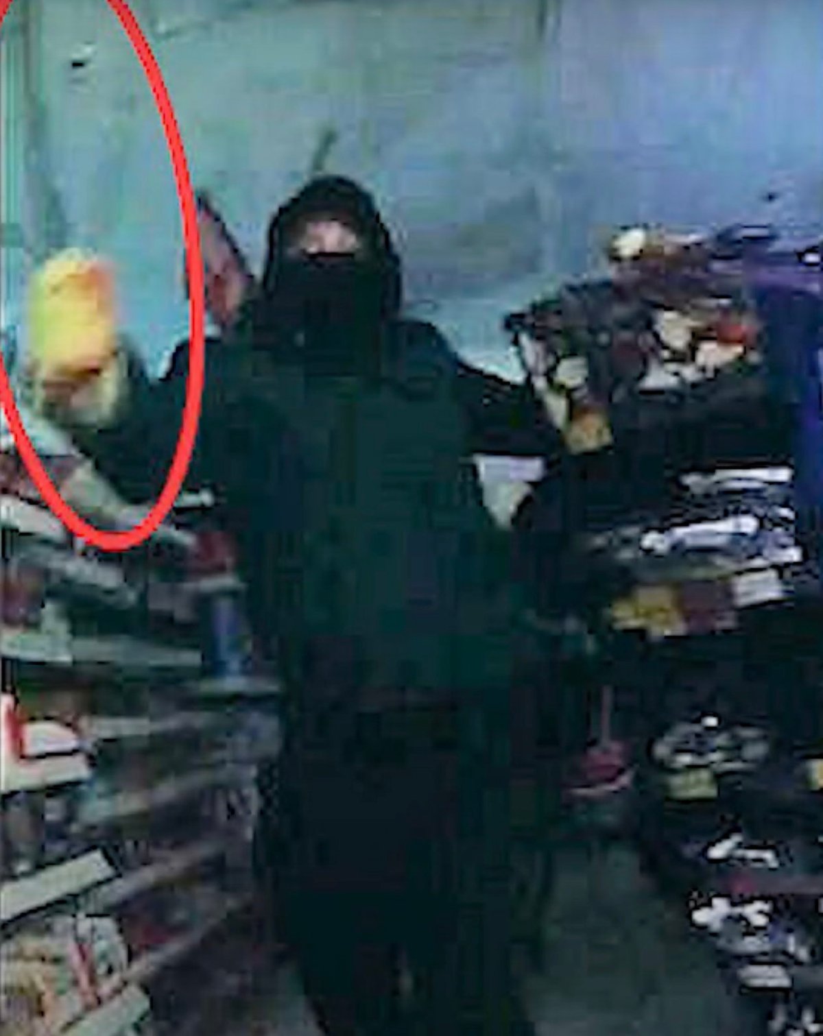 Caught on CCTV: Armed robber with crowbar runs at cop during foiled shop raid